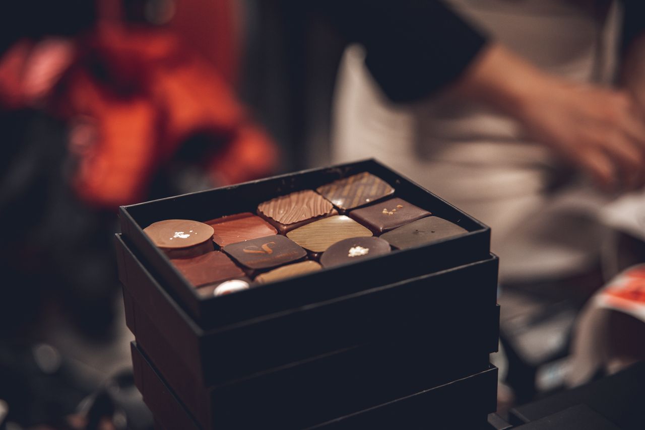 An open gift box of assorted chocolates